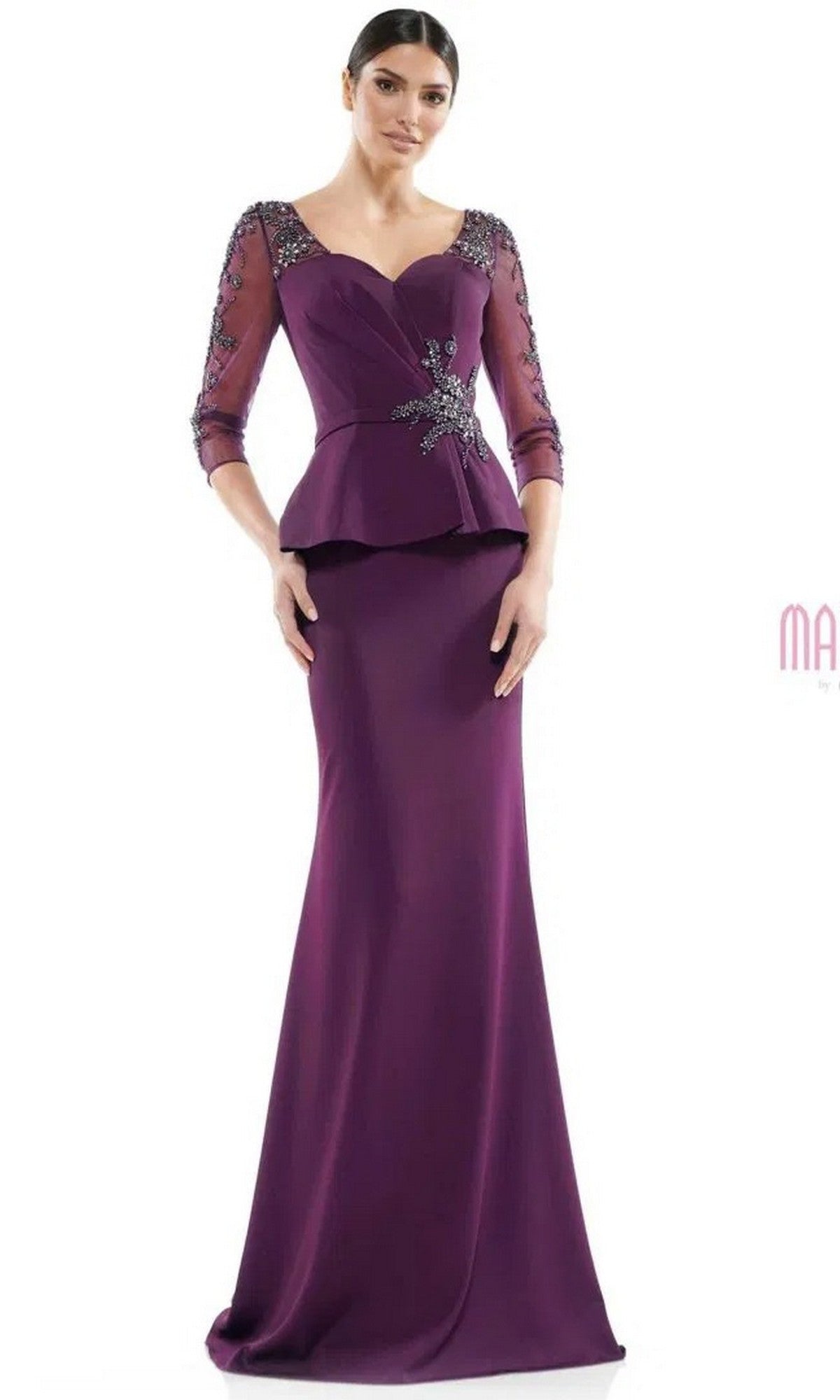 A woman wears the Marsoni MV1037 long formal dress in eggplant, featuring beaded details on the sleeves and bodice, a peplum waist, and three-quarter sleeves.